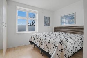 a bedroom with a bed and a window at Apartment in central Holstebro in Holstebro