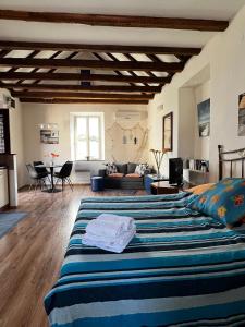 a bedroom with a large bed and a living room at Split Inn Apartments in Split