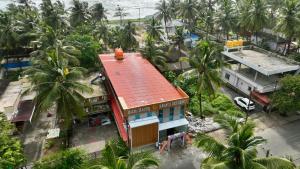 an overhead view of a building with a red roof at Kanasu Residency Malpe in Udupi