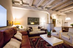 a living room with a couch and a table at Mendiburu Rural Boutique in Osinaga