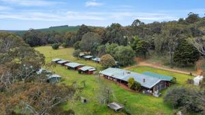 an aerial view of a farm with buildings and trees at Kin Kin Retreat in Quinninup