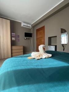 a dress is sitting on top of a bed at B&b cuore di casa in Ferno