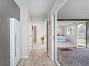 a hallway of a house with a bedroom at Soleil Studio - Whangamata Self-contained Unit in Whangamata