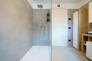 a shower with a glass door in a bathroom at CT Executive Rooms, Lake Como and Valtellina in Dubino +30 photos
