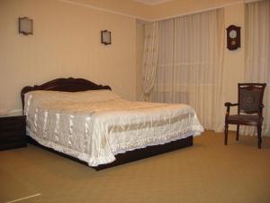 Postel nebo postele na pokoji v ubytování Hotel Botakoz