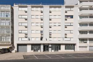 an empty parking lot in front of an apartment building at LSA Campos by Numa in Lisbon