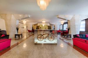 Uma área de estar em FH55 Grand Hotel Palatino