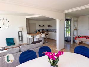 a living room with a couch and a table at Tranquiloue - Maison de Campagne - PuyduFou in Treize-Vents