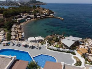 an aerial view of a resort with a pool and a beach at YAZ Yalıkavak in Yalıkavak