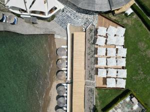 an overhead view of a building with a boat at YAZ Yalıkavak in Yalıkavak