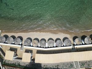 an overhead view of a beach with a row of rocks at YAZ Yalıkavak in Yalıkavak +74 photos