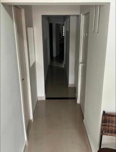 a hallway of a building with a long corridor at Pousada 705 norte 1 in Brasília