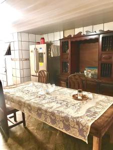 a kitchen with a table with a table cloth on it at casa boa vista in Recife