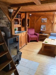 a living room with a stove in a cabin at Ferienwohnung Sternenzauber in Bad Münstereifel