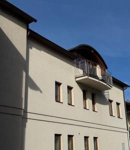 a building with a balcony on the side of it at Apartmány U Stadionu in Šumperk