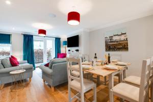 a dining room and living room with a table and chairs at 3 Bed in Helmsley oc-y111 in Helmsley