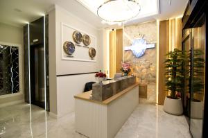 a lobby with a reception counter and plates on the wall at Forty Nişantaşı Hotel & SPA in Istanbul +67 photos