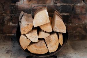 a bowl full of sliced bread on a brick wall at Meldon Cottage with Private Hot Tub in Newbiggin-by-the-Sea