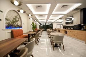 a row of tables and chairs in a restaurant at Forty Nişantaşı Hotel & SPA in Istanbul