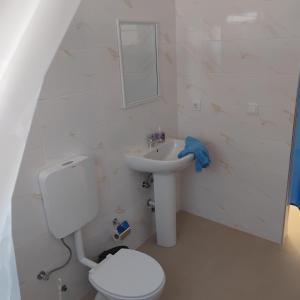 a bathroom with a toilet and a sink at Artimar- B&Breakfast in Ponta do Sol +13 photos