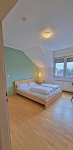 a bedroom with a large bed in a room at Le Relais - Appart'Hotel in Düsseldorf