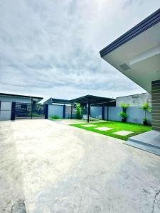 an empty parking lot in front of a house at Jumira Staycation in Tagum