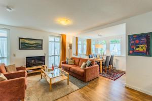 a living room with a couch and a table at Villa Eden II in Binz
