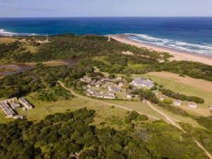 an aerial view of a house next to a beach at THE HAVEN HOTEL in Mpume