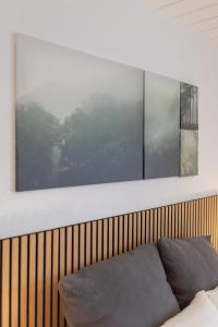 a couch in a room with a large window at City Green Appartement in Bad Lippspringe