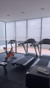 a gym with two exercise bikes in a room at Elegante, sofisticado, acogedor, moderno, turismo in Ciudad del Este