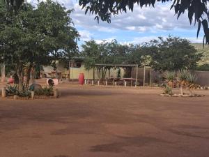 a park with a picnic table and a tent at Camping Lamadrague in Opuwo