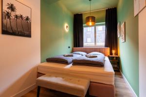 a bedroom with a bed and a window at Marios Mansion in Leipzig