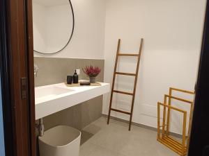 a bathroom with a sink and a mirror at B & B Villa Flora in Mondello +61 photos