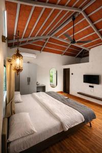 a bedroom with a large bed in a room at Shwetik Resort in Khamshet