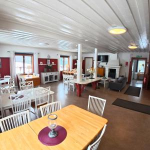 a living room with a table and chairs at Årsunda Strandbad Sjösunda vandrarhem in Årsunda
