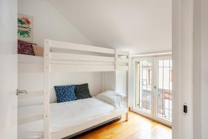 a bedroom with two bunk beds and a window at Independent house private garden in Milan