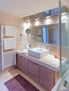 a bathroom with a sink and a mirror at Alpha Luxury Villa - Private Pool & VIP Services in Platanias +36 photos