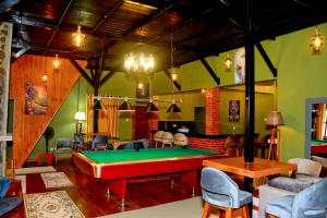 a billiard room with a pool table in it at The Rusty Villa in Hatton