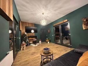 a living room with a couch and a table at Chalet Alex in Fundata
