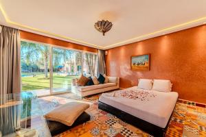 a bedroom with a bed and a couch at Palais Pyar Luxury and Serenity Setting in Najem +68 photos