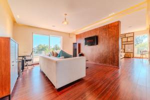 a living room with a white couch and a table at Palais Pyar Luxury and Serenity Setting in Najem