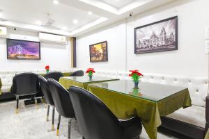a meeting room with a table and chairs at FabHotel Continental in kolkata