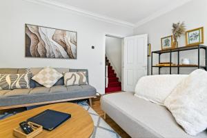 a living room with a couch and a table at Wolfe Tone Apartment 2 in Sligo