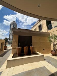 three potted plants sitting on top of a building at Michelangelo Towers in Johannesburg