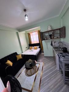 a living room with a couch and a table at H lacasa in Voi