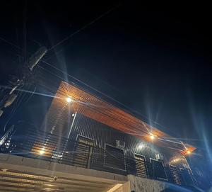 a building with lights on the side of it at night at Evas Inn in General Santos