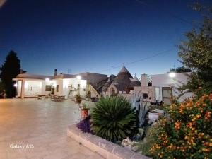 a house with a courtyard with plants and buildings at Dolce VillaCastelli in Villa Castelli
