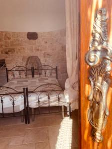a bedroom with two beds and a wooden door at Dolce VillaCastelli in Villa Castelli +61 photos