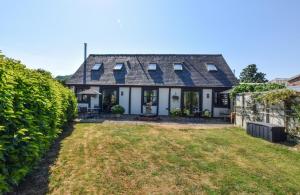 an exterior view of a house with a yard at 2 Bed in Welshpool oc-75703 in Meifod