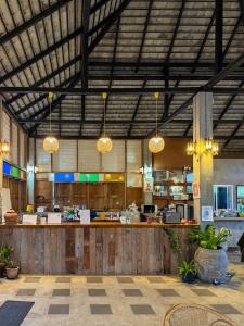 a large building with a restaurant with a counter at Paihappyvillage in Pai
